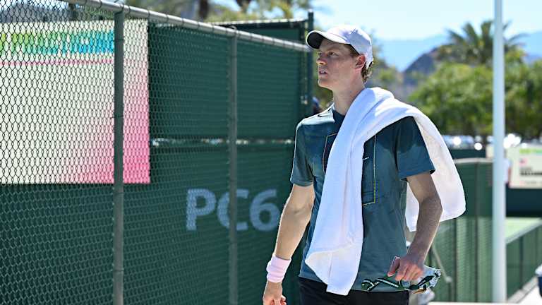 Jannik heads back inside after signing autographs following his midday practice.